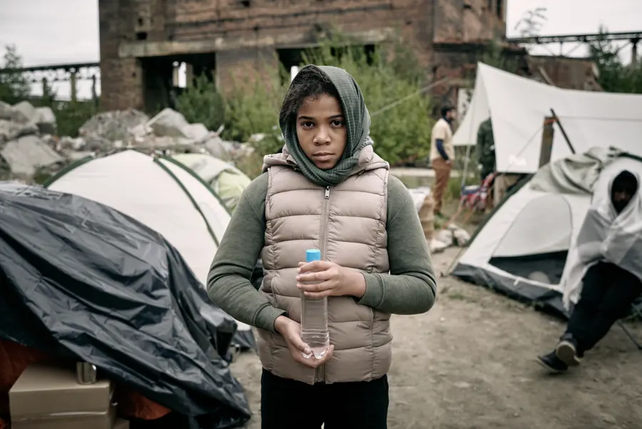 A child holding a water bottle