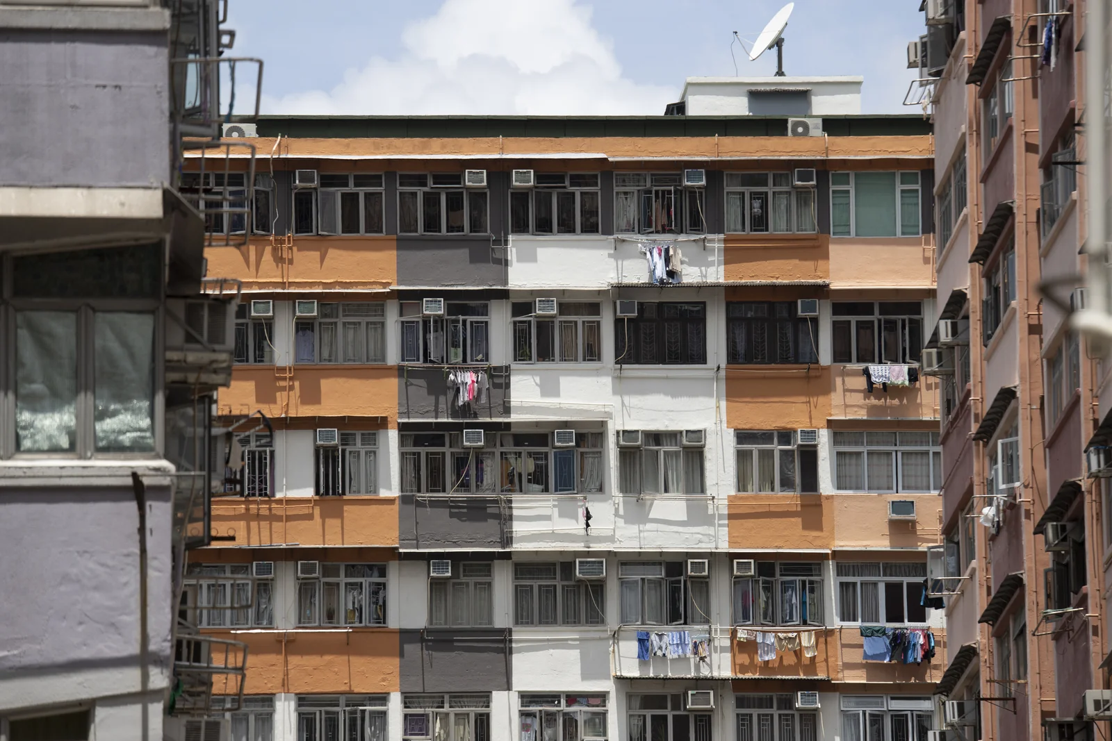 Windows, air conditioners and laundry on residential buildings in Hong Kong